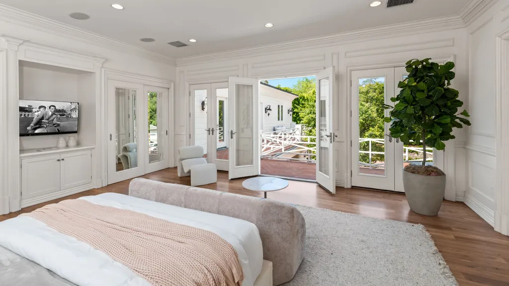 10250 West Sunset Boulevard Home in Los Angeles, California. Discover the epitome of luxury living at this meticulously reimagined Paul Williams designed estate in Holmby Hills, spanning approximately 2.8 acres. Comprising three structures with nearly 30,000 SF of living space, this world-class property offers unrivaled privacy, an expansive motor court, 14 bedrooms, 25 baths, and an array of amenities including a theater, game room, and a wellness-focused pool house. 