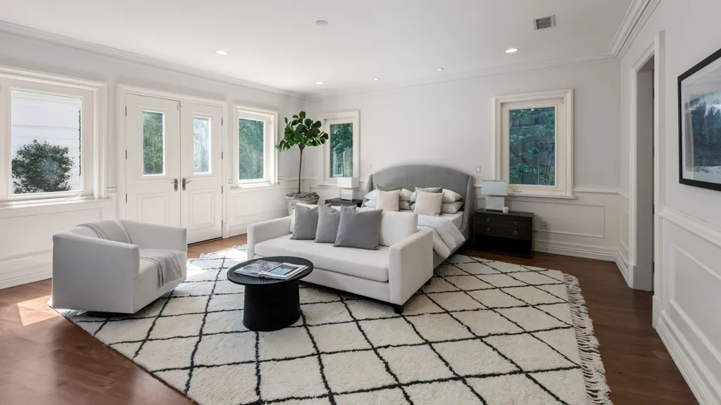 10250 West Sunset Boulevard Home in Los Angeles, California. Discover the epitome of luxury living at this meticulously reimagined Paul Williams designed estate in Holmby Hills, spanning approximately 2.8 acres. Comprising three structures with nearly 30,000 SF of living space, this world-class property offers unrivaled privacy, an expansive motor court, 14 bedrooms, 25 baths, and an array of amenities including a theater, game room, and a wellness-focused pool house. 