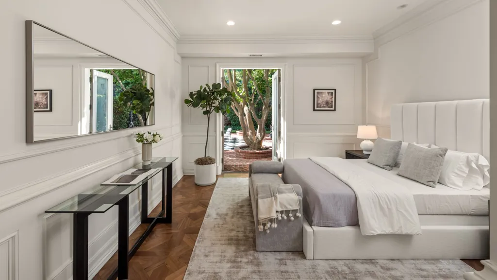 10250 West Sunset Boulevard Home in Los Angeles, California. Discover the epitome of luxury living at this meticulously reimagined Paul Williams designed estate in Holmby Hills, spanning approximately 2.8 acres. Comprising three structures with nearly 30,000 SF of living space, this world-class property offers unrivaled privacy, an expansive motor court, 14 bedrooms, 25 baths, and an array of amenities including a theater, game room, and a wellness-focused pool house. 
