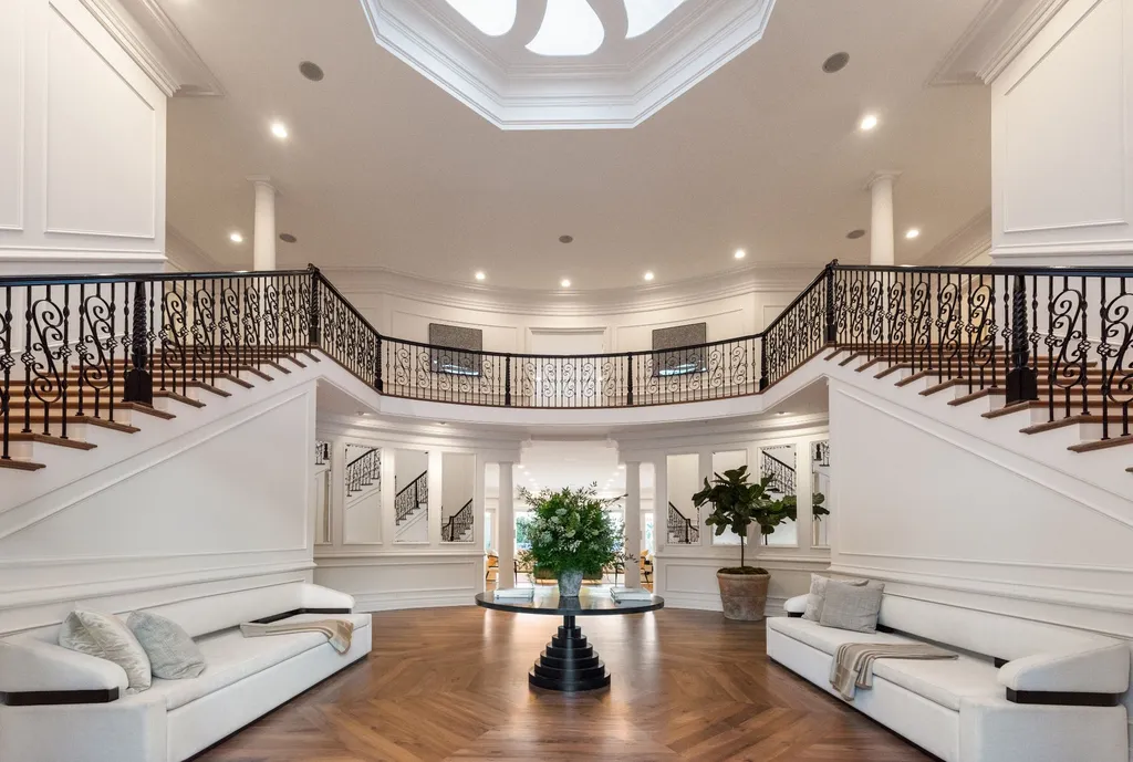 10250 West Sunset Boulevard Home in Los Angeles, California. Discover the epitome of luxury living at this meticulously reimagined Paul Williams designed estate in Holmby Hills, spanning approximately 2.8 acres. Comprising three structures with nearly 30,000 SF of living space, this world-class property offers unrivaled privacy, an expansive motor court, 14 bedrooms, 25 baths, and an array of amenities including a theater, game room, and a wellness-focused pool house. 