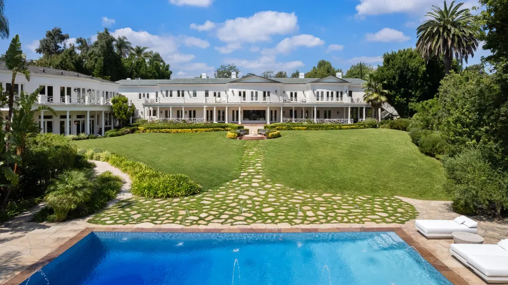 10250 West Sunset Boulevard Home in Los Angeles, California. Discover the epitome of luxury living at this meticulously reimagined Paul Williams designed estate in Holmby Hills, spanning approximately 2.8 acres. Comprising three structures with nearly 30,000 SF of living space, this world-class property offers unrivaled privacy, an expansive motor court, 14 bedrooms, 25 baths, and an array of amenities including a theater, game room, and a wellness-focused pool house. 