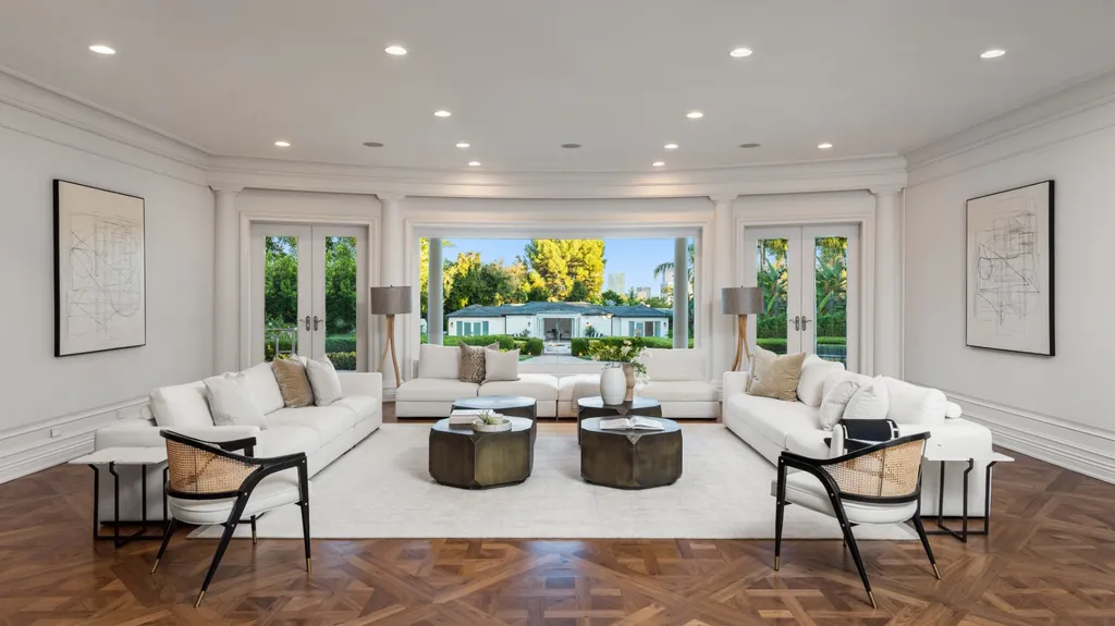 10250 West Sunset Boulevard Home in Los Angeles, California. Discover the epitome of luxury living at this meticulously reimagined Paul Williams designed estate in Holmby Hills, spanning approximately 2.8 acres. Comprising three structures with nearly 30,000 SF of living space, this world-class property offers unrivaled privacy, an expansive motor court, 14 bedrooms, 25 baths, and an array of amenities including a theater, game room, and a wellness-focused pool house. 