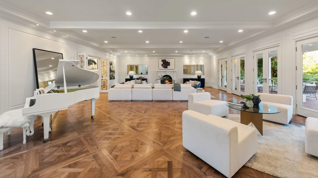 10250 West Sunset Boulevard Home in Los Angeles, California. Discover the epitome of luxury living at this meticulously reimagined Paul Williams designed estate in Holmby Hills, spanning approximately 2.8 acres. Comprising three structures with nearly 30,000 SF of living space, this world-class property offers unrivaled privacy, an expansive motor court, 14 bedrooms, 25 baths, and an array of amenities including a theater, game room, and a wellness-focused pool house. 