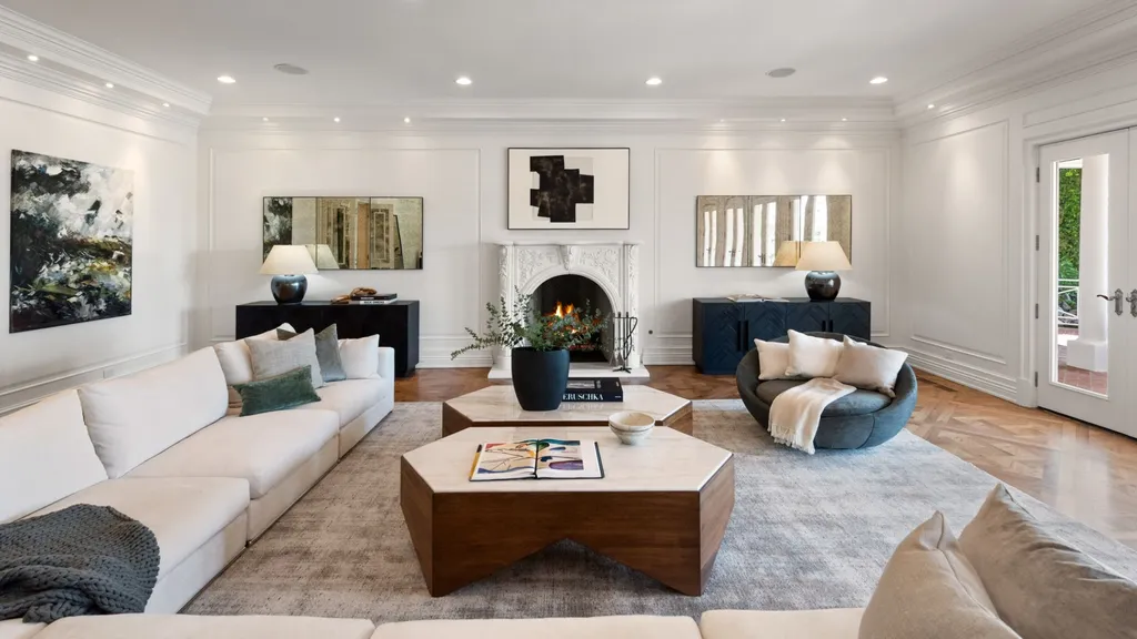 10250 West Sunset Boulevard Home in Los Angeles, California. Discover the epitome of luxury living at this meticulously reimagined Paul Williams designed estate in Holmby Hills, spanning approximately 2.8 acres. Comprising three structures with nearly 30,000 SF of living space, this world-class property offers unrivaled privacy, an expansive motor court, 14 bedrooms, 25 baths, and an array of amenities including a theater, game room, and a wellness-focused pool house. 