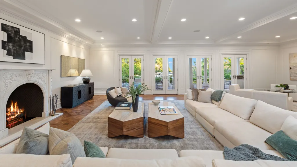 10250 West Sunset Boulevard Home in Los Angeles, California. Discover the epitome of luxury living at this meticulously reimagined Paul Williams designed estate in Holmby Hills, spanning approximately 2.8 acres. Comprising three structures with nearly 30,000 SF of living space, this world-class property offers unrivaled privacy, an expansive motor court, 14 bedrooms, 25 baths, and an array of amenities including a theater, game room, and a wellness-focused pool house. 