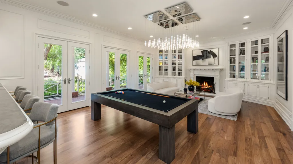 10250 West Sunset Boulevard Home in Los Angeles, California. Discover the epitome of luxury living at this meticulously reimagined Paul Williams designed estate in Holmby Hills, spanning approximately 2.8 acres. Comprising three structures with nearly 30,000 SF of living space, this world-class property offers unrivaled privacy, an expansive motor court, 14 bedrooms, 25 baths, and an array of amenities including a theater, game room, and a wellness-focused pool house. 