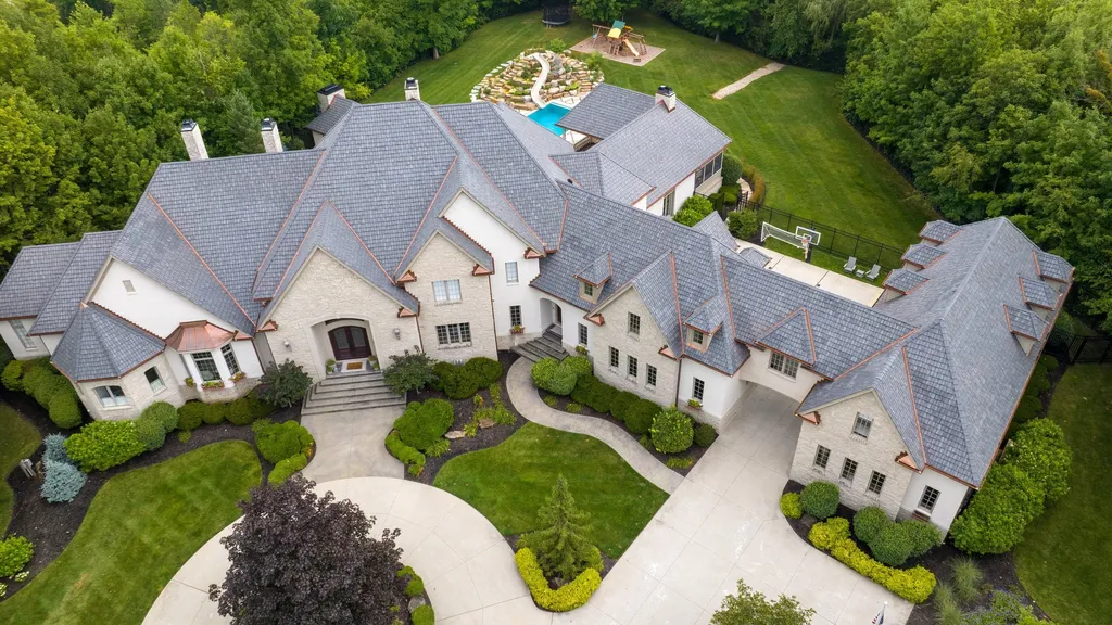 11101 Hawthorn Ridge Home in Fishers, Indiana. Explore the breathtaking elegance of 11101 Hawthorn Ridge, a custom-designed estate in Hamilton Proper. Nestled on over 6 acres of meticulously landscaped grounds, this gated residence offers unparalleled privacy and sophistication.