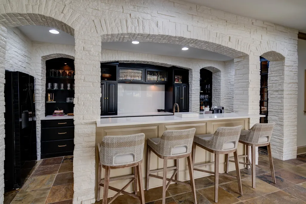 11101 Hawthorn Ridge Home in Fishers, Indiana. Explore the breathtaking elegance of 11101 Hawthorn Ridge, a custom-designed estate in Hamilton Proper. Nestled on over 6 acres of meticulously landscaped grounds, this gated residence offers unparalleled privacy and sophistication.