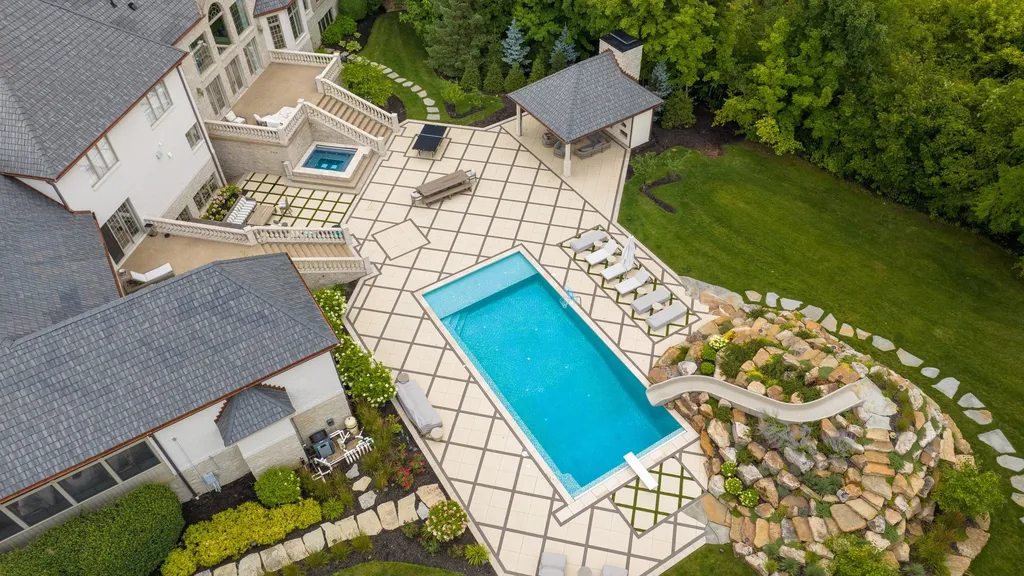 11101 Hawthorn Ridge Home in Fishers, Indiana. Explore the breathtaking elegance of 11101 Hawthorn Ridge, a custom-designed estate in Hamilton Proper. Nestled on over 6 acres of meticulously landscaped grounds, this gated residence offers unparalleled privacy and sophistication.