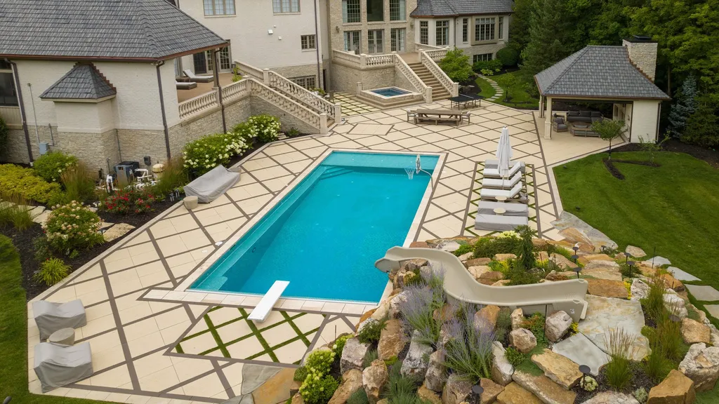 11101 Hawthorn Ridge Home in Fishers, Indiana. Explore the breathtaking elegance of 11101 Hawthorn Ridge, a custom-designed estate in Hamilton Proper. Nestled on over 6 acres of meticulously landscaped grounds, this gated residence offers unparalleled privacy and sophistication.
