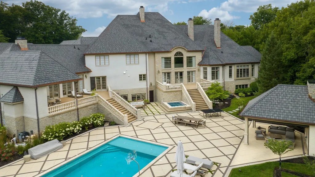 11101 Hawthorn Ridge Home in Fishers, Indiana. Explore the breathtaking elegance of 11101 Hawthorn Ridge, a custom-designed estate in Hamilton Proper. Nestled on over 6 acres of meticulously landscaped grounds, this gated residence offers unparalleled privacy and sophistication.