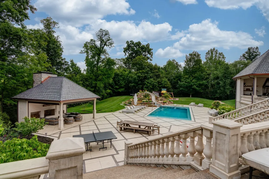 11101 Hawthorn Ridge Home in Fishers, Indiana. Explore the breathtaking elegance of 11101 Hawthorn Ridge, a custom-designed estate in Hamilton Proper. Nestled on over 6 acres of meticulously landscaped grounds, this gated residence offers unparalleled privacy and sophistication.