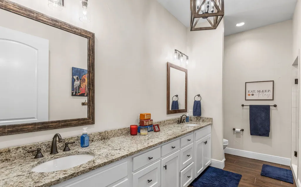 1134 Kinta Trial Home in Wichita Falls, Texas. Discover this unique 10-acre property in Clay County, featuring a stunning 6-bedroom home with 6.5 bathrooms, 6 fireplaces, a heated pool, outdoor kitchen, and even a catfish pond for fishing.