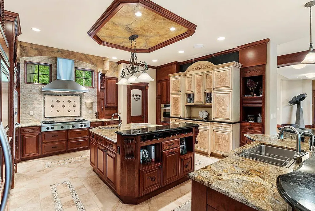This stunning lakefront home is located in Cormorant Park Place, a premier lakeshore community. It has 6 bedrooms, 5 bathrooms, and 9,595 square feet of living space. The home features soaring ceilings, grand windows, hand-hewn imported wood, and hand-picked stone surfaces. It also has a private terrace with a fire pit, and access to the community's amenities, including a clubhouse, heated pool, swim beach, and slip system.