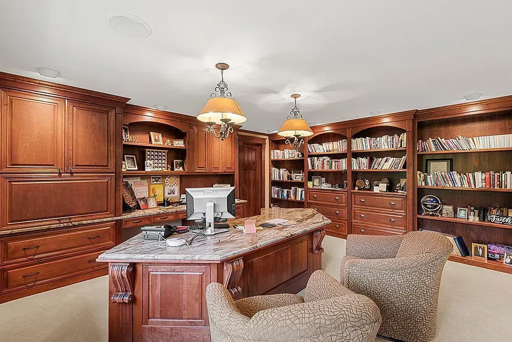 This stunning lakefront home is located in Cormorant Park Place, a premier lakeshore community. It has 6 bedrooms, 5 bathrooms, and 9,595 square feet of living space. The home features soaring ceilings, grand windows, hand-hewn imported wood, and hand-picked stone surfaces. It also has a private terrace with a fire pit, and access to the community's amenities, including a clubhouse, heated pool, swim beach, and slip system.