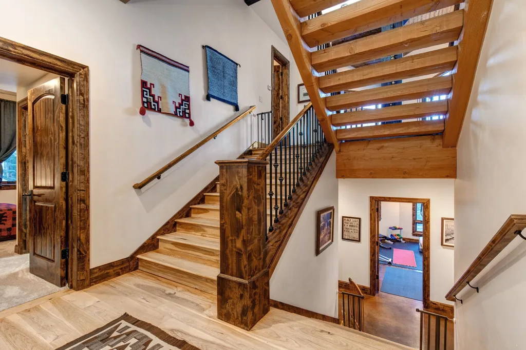 147 White Pine Canyon Road Home in Park City, Utah. Perched atop The Colony, Park City's premier gated ski-in ski-out neighborhood, this quintessential mountain home offers unmatched privacy, ski access, and breathtaking views. Set on 4.6 secluded acres, this property provides a tranquil escape for friends and families to embrace the mountain lifestyle. 