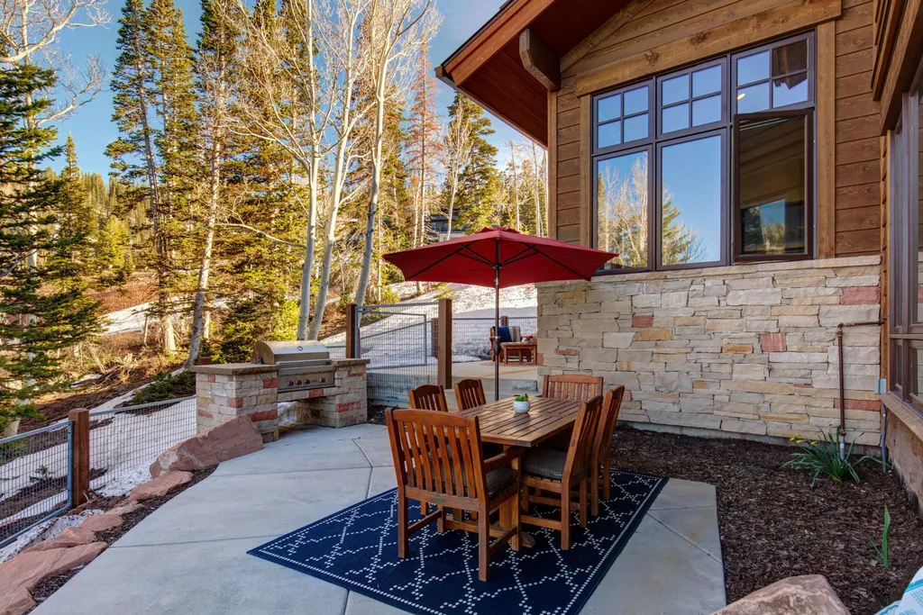 147 White Pine Canyon Road Home in Park City, Utah. Perched atop The Colony, Park City's premier gated ski-in ski-out neighborhood, this quintessential mountain home offers unmatched privacy, ski access, and breathtaking views. Set on 4.6 secluded acres, this property provides a tranquil escape for friends and families to embrace the mountain lifestyle. 