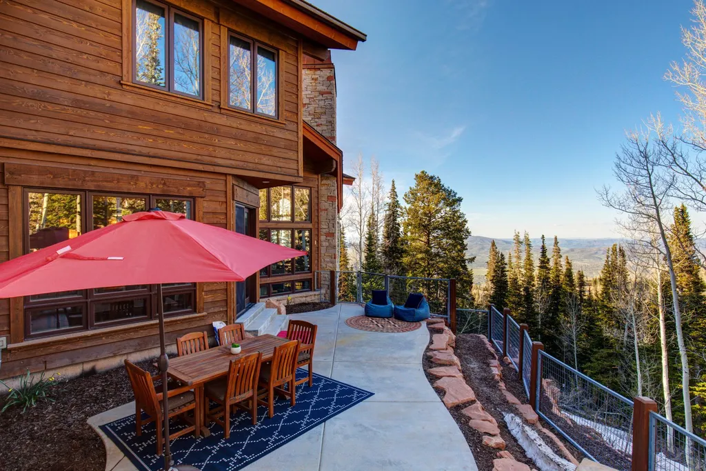 147 White Pine Canyon Road Home in Park City, Utah. Perched atop The Colony, Park City's premier gated ski-in ski-out neighborhood, this quintessential mountain home offers unmatched privacy, ski access, and breathtaking views. Set on 4.6 secluded acres, this property provides a tranquil escape for friends and families to embrace the mountain lifestyle. 