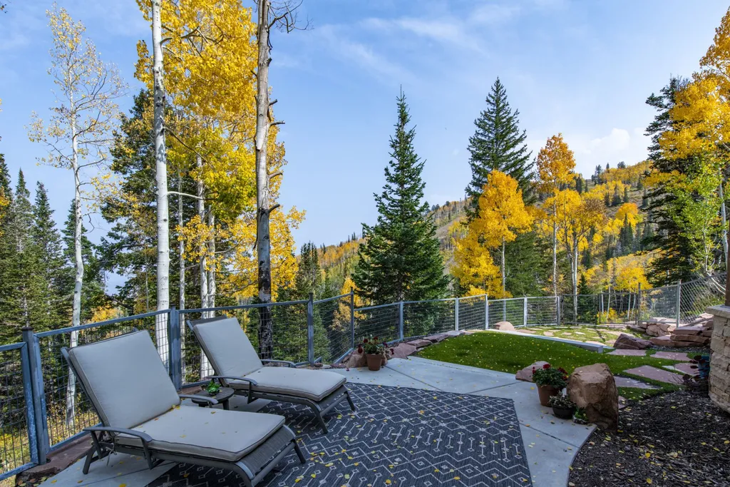 147 White Pine Canyon Road Home in Park City, Utah. Perched atop The Colony, Park City's premier gated ski-in ski-out neighborhood, this quintessential mountain home offers unmatched privacy, ski access, and breathtaking views. Set on 4.6 secluded acres, this property provides a tranquil escape for friends and families to embrace the mountain lifestyle. 