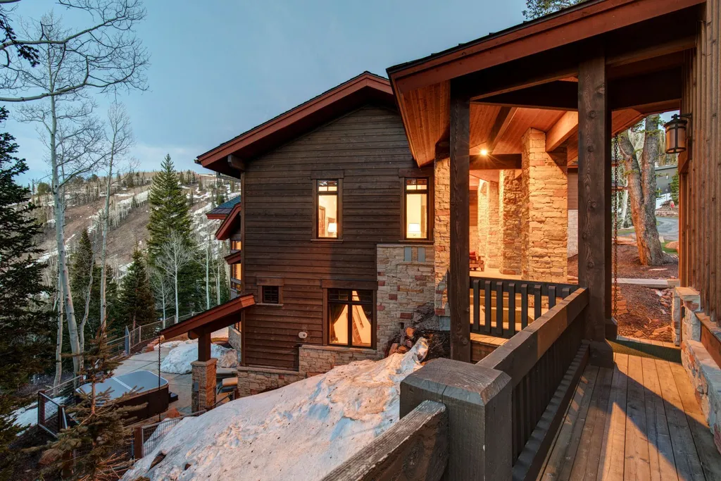 147 White Pine Canyon Road Home in Park City, Utah. Perched atop The Colony, Park City's premier gated ski-in ski-out neighborhood, this quintessential mountain home offers unmatched privacy, ski access, and breathtaking views. Set on 4.6 secluded acres, this property provides a tranquil escape for friends and families to embrace the mountain lifestyle. 