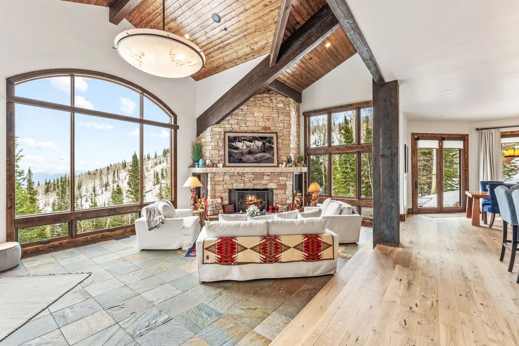 147 White Pine Canyon Road Home in Park City, Utah. Perched atop The Colony, Park City's premier gated ski-in ski-out neighborhood, this quintessential mountain home offers unmatched privacy, ski access, and breathtaking views. Set on 4.6 secluded acres, this property provides a tranquil escape for friends and families to embrace the mountain lifestyle. 