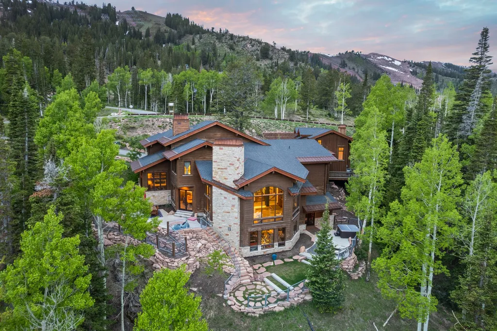 147 White Pine Canyon Road Home in Park City, Utah. Perched atop The Colony, Park City's premier gated ski-in ski-out neighborhood, this quintessential mountain home offers unmatched privacy, ski access, and breathtaking views. Set on 4.6 secluded acres, this property provides a tranquil escape for friends and families to embrace the mountain lifestyle. 