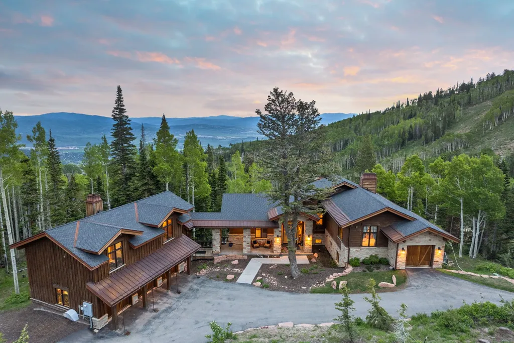 147 White Pine Canyon Road Home in Park City, Utah. Perched atop The Colony, Park City's premier gated ski-in ski-out neighborhood, this quintessential mountain home offers unmatched privacy, ski access, and breathtaking views. Set on 4.6 secluded acres, this property provides a tranquil escape for friends and families to embrace the mountain lifestyle. 