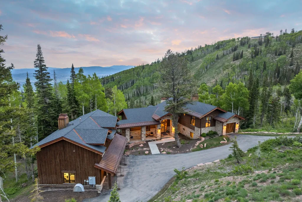 147 White Pine Canyon Road Home in Park City, Utah. Perched atop The Colony, Park City's premier gated ski-in ski-out neighborhood, this quintessential mountain home offers unmatched privacy, ski access, and breathtaking views. Set on 4.6 secluded acres, this property provides a tranquil escape for friends and families to embrace the mountain lifestyle. 