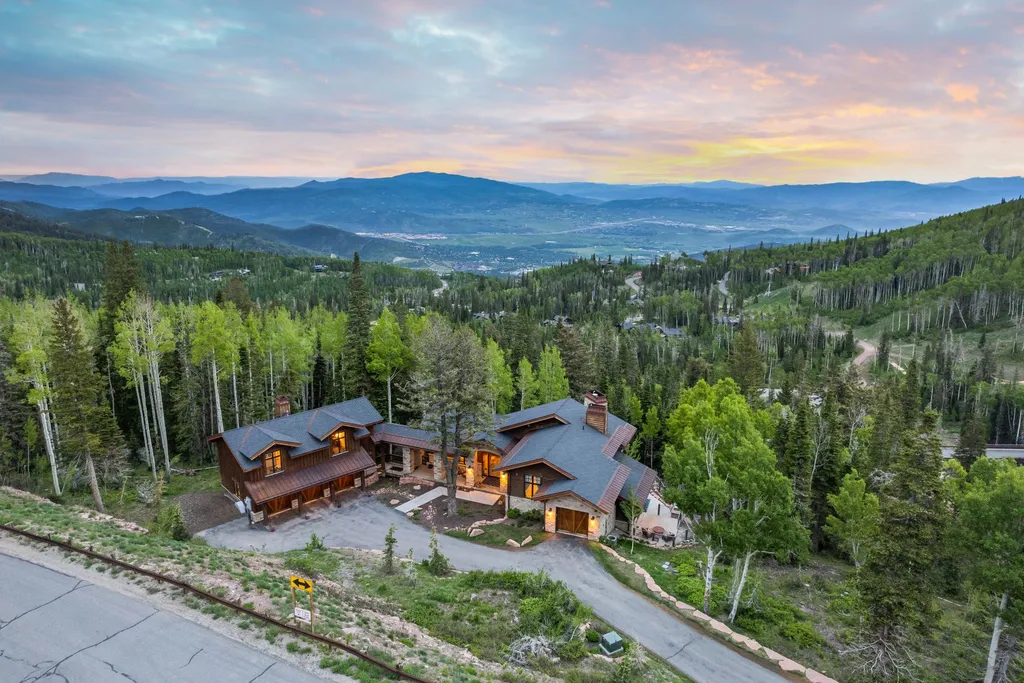 147 White Pine Canyon Road Home in Park City, Utah. Perched atop The Colony, Park City's premier gated ski-in ski-out neighborhood, this quintessential mountain home offers unmatched privacy, ski access, and breathtaking views. Set on 4.6 secluded acres, this property provides a tranquil escape for friends and families to embrace the mountain lifestyle. 