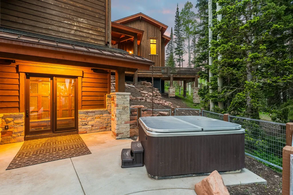 147 White Pine Canyon Road Home in Park City, Utah. Perched atop The Colony, Park City's premier gated ski-in ski-out neighborhood, this quintessential mountain home offers unmatched privacy, ski access, and breathtaking views. Set on 4.6 secluded acres, this property provides a tranquil escape for friends and families to embrace the mountain lifestyle. 