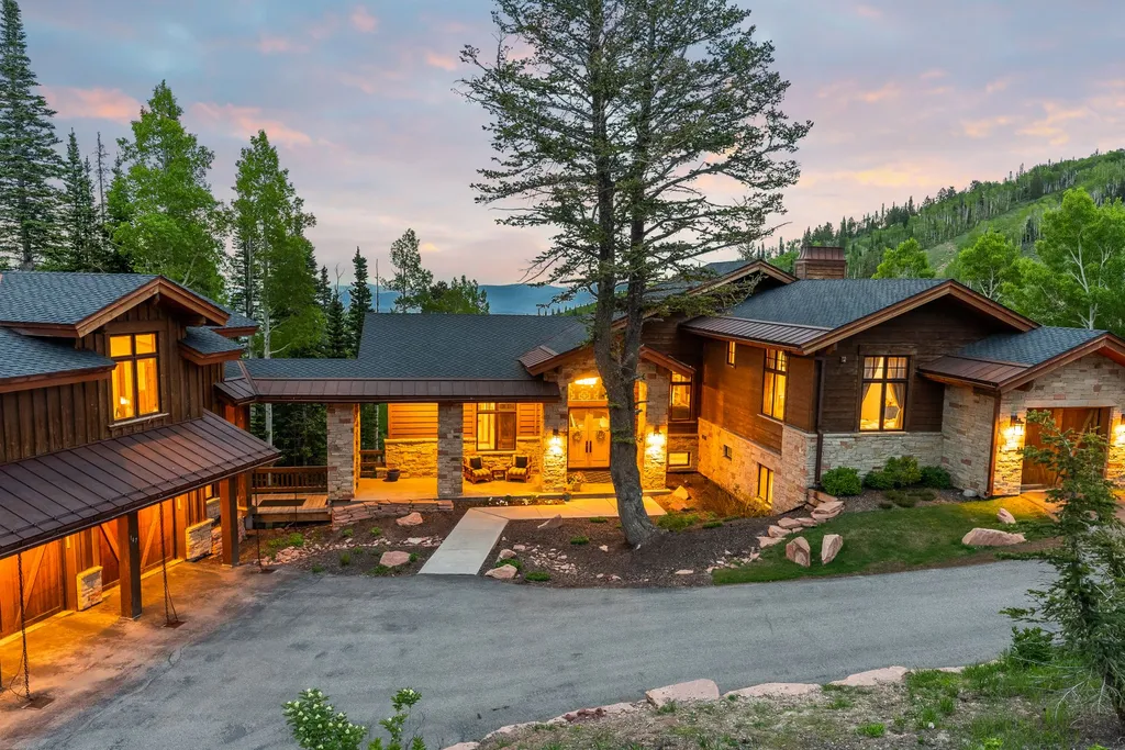 147 White Pine Canyon Road Home in Park City, Utah. Perched atop The Colony, Park City's premier gated ski-in ski-out neighborhood, this quintessential mountain home offers unmatched privacy, ski access, and breathtaking views. Set on 4.6 secluded acres, this property provides a tranquil escape for friends and families to embrace the mountain lifestyle. 