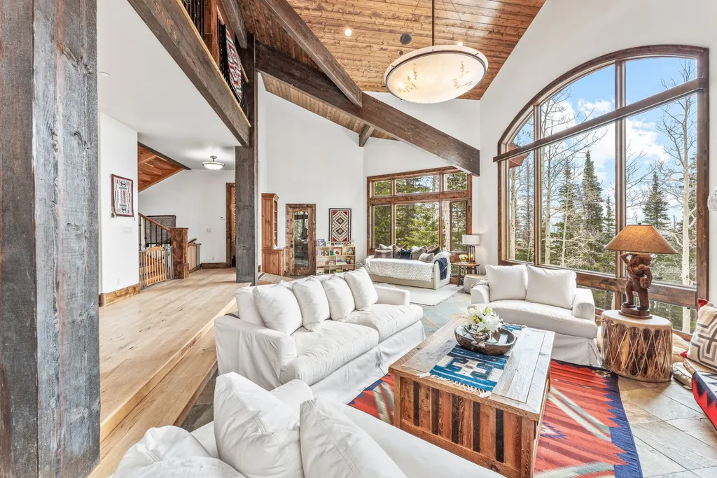 147 White Pine Canyon Road Home in Park City, Utah. Perched atop The Colony, Park City's premier gated ski-in ski-out neighborhood, this quintessential mountain home offers unmatched privacy, ski access, and breathtaking views. Set on 4.6 secluded acres, this property provides a tranquil escape for friends and families to embrace the mountain lifestyle. 