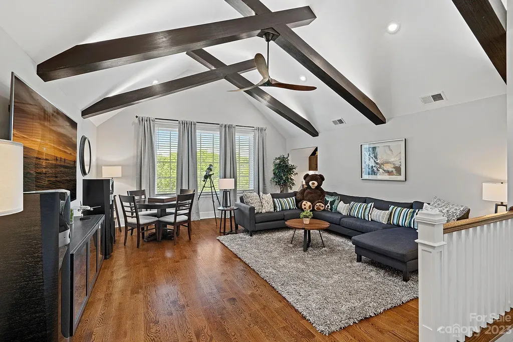 This stunning home in Providence Downs South offers luxury resort living with spa-like amenities, perfect for entertaining and relaxing. It has 5 bedrooms, 4 full baths, and 3 half baths, plus a 4-car garage with epoxy floor. The kitchen has a huge island with Wolf & Subzero appliances, and the backyard has a heated pool, hot tub, and pool house with sauna. 