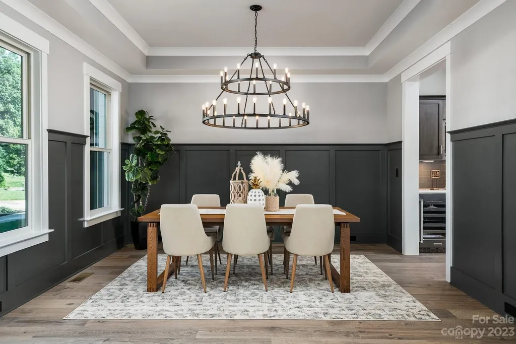 155 Riverwood Road Home in Mooresville, North Carolina. Experience the epitome of luxury in this new construction home on Lake Norman. Boasting 4 bedrooms, 4.5 bathrooms, a pool, dock, and breathtaking lake views, this home offers a lifestyle of comfort and elegance. 