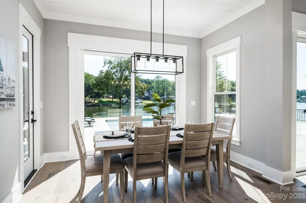 155 Riverwood Road Home in Mooresville, North Carolina. Experience the epitome of luxury in this new construction home on Lake Norman. Boasting 4 bedrooms, 4.5 bathrooms, a pool, dock, and breathtaking lake views, this home offers a lifestyle of comfort and elegance. 