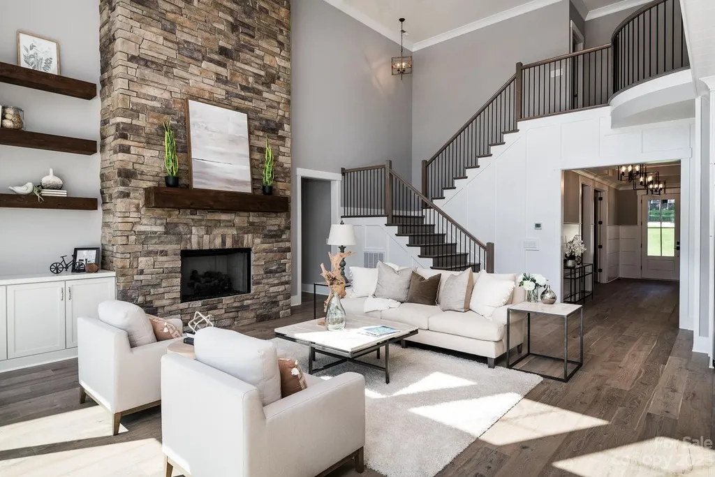 155 Riverwood Road Home in Mooresville, North Carolina. Experience the epitome of luxury in this new construction home on Lake Norman. Boasting 4 bedrooms, 4.5 bathrooms, a pool, dock, and breathtaking lake views, this home offers a lifestyle of comfort and elegance. 