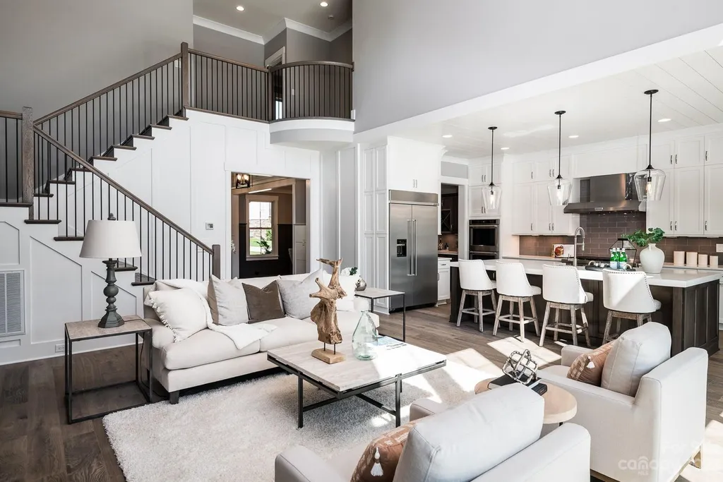155 Riverwood Road Home in Mooresville, North Carolina. Experience the epitome of luxury in this new construction home on Lake Norman. Boasting 4 bedrooms, 4.5 bathrooms, a pool, dock, and breathtaking lake views, this home offers a lifestyle of comfort and elegance. 