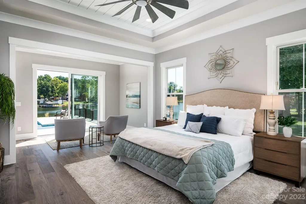 155 Riverwood Road Home in Mooresville, North Carolina. Experience the epitome of luxury in this new construction home on Lake Norman. Boasting 4 bedrooms, 4.5 bathrooms, a pool, dock, and breathtaking lake views, this home offers a lifestyle of comfort and elegance. 