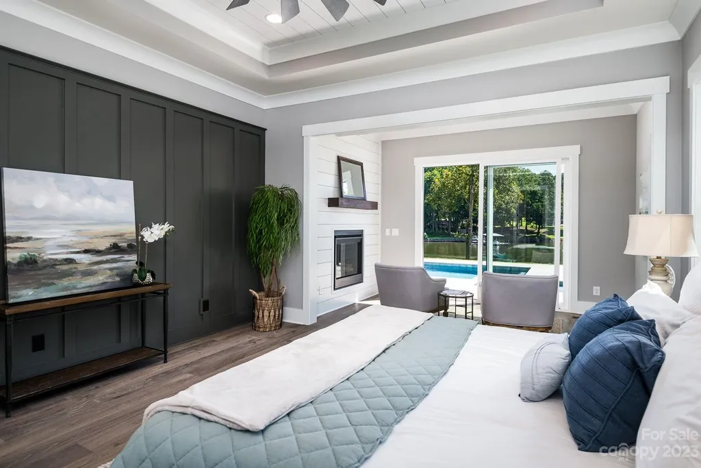 155 Riverwood Road Home in Mooresville, North Carolina. Experience the epitome of luxury in this new construction home on Lake Norman. Boasting 4 bedrooms, 4.5 bathrooms, a pool, dock, and breathtaking lake views, this home offers a lifestyle of comfort and elegance. 