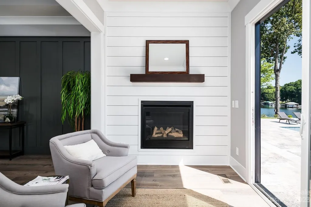155 Riverwood Road Home in Mooresville, North Carolina. Experience the epitome of luxury in this new construction home on Lake Norman. Boasting 4 bedrooms, 4.5 bathrooms, a pool, dock, and breathtaking lake views, this home offers a lifestyle of comfort and elegance. 