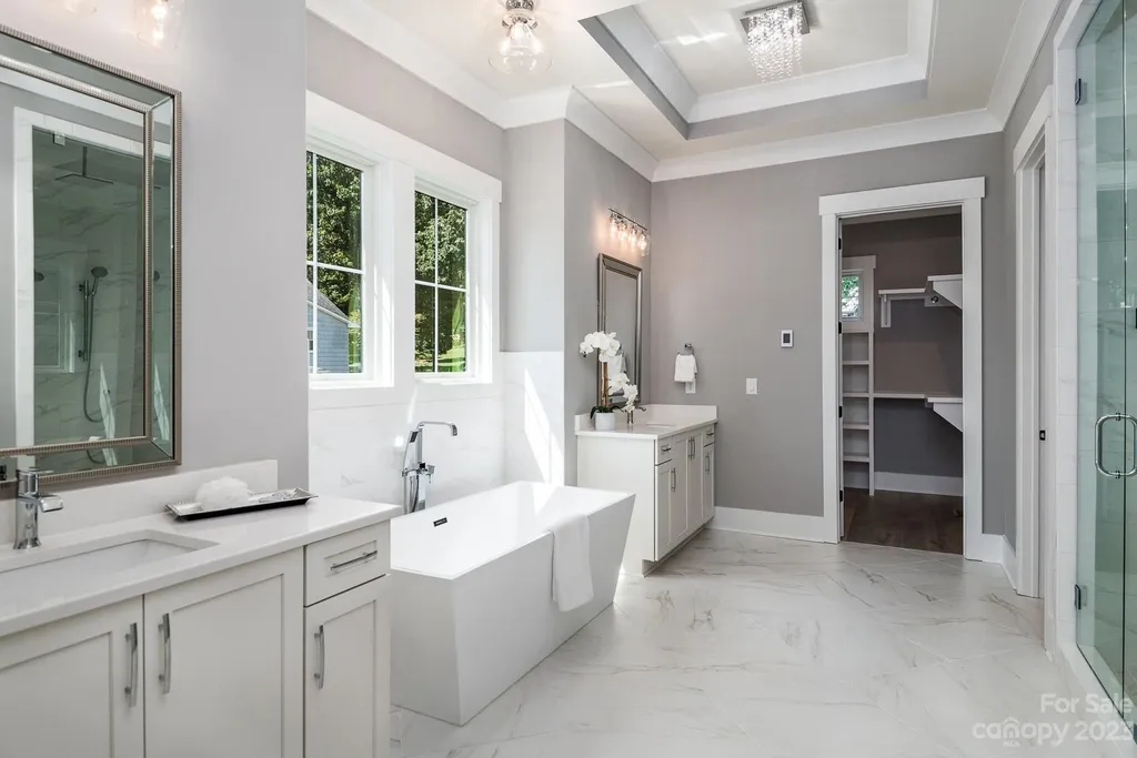 155 Riverwood Road Home in Mooresville, North Carolina. Experience the epitome of luxury in this new construction home on Lake Norman. Boasting 4 bedrooms, 4.5 bathrooms, a pool, dock, and breathtaking lake views, this home offers a lifestyle of comfort and elegance. 