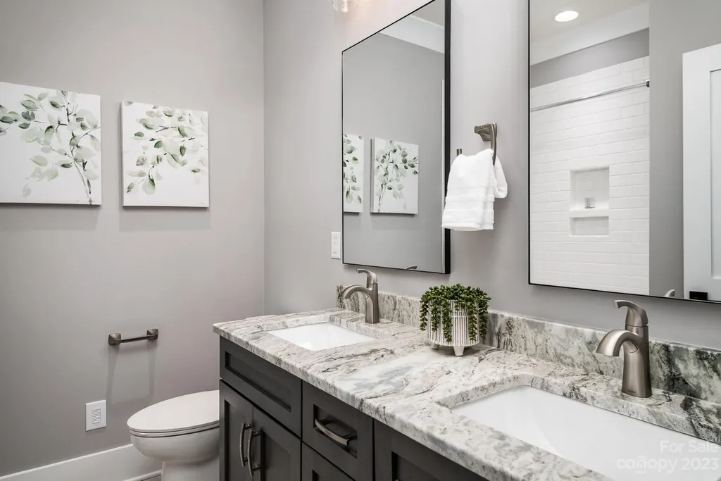 155 Riverwood Road Home in Mooresville, North Carolina. Experience the epitome of luxury in this new construction home on Lake Norman. Boasting 4 bedrooms, 4.5 bathrooms, a pool, dock, and breathtaking lake views, this home offers a lifestyle of comfort and elegance. 