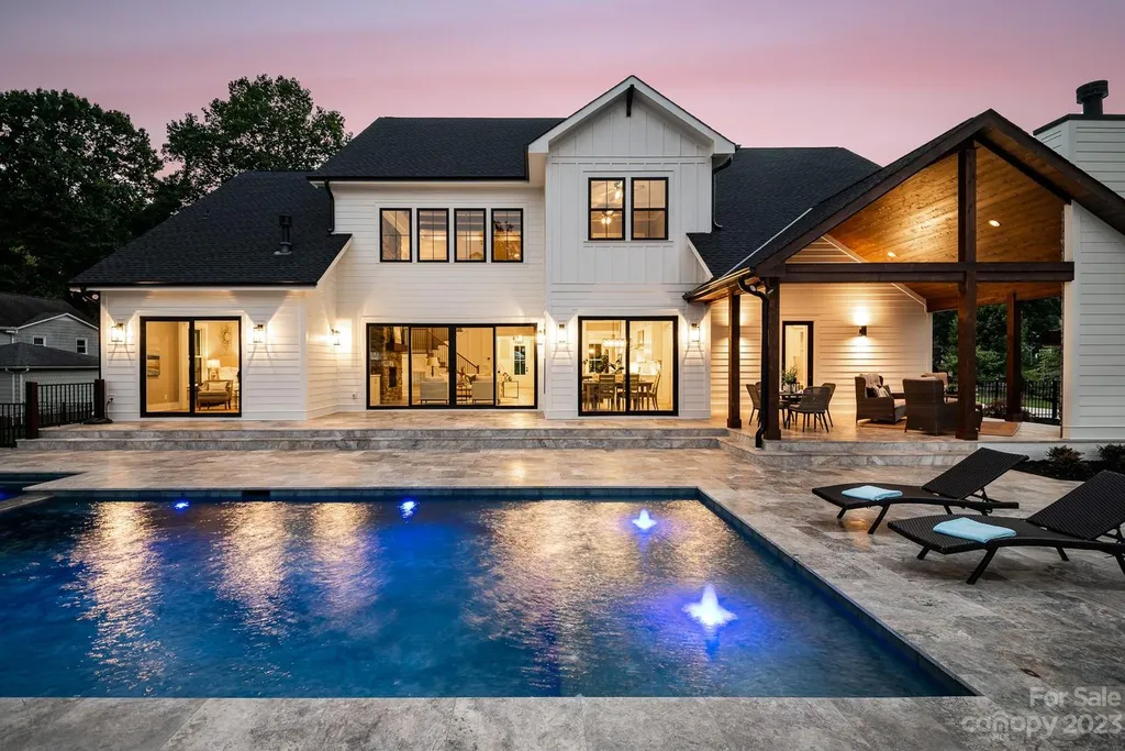 155 Riverwood Road Home in Mooresville, North Carolina. Experience the epitome of luxury in this new construction home on Lake Norman. Boasting 4 bedrooms, 4.5 bathrooms, a pool, dock, and breathtaking lake views, this home offers a lifestyle of comfort and elegance. 
