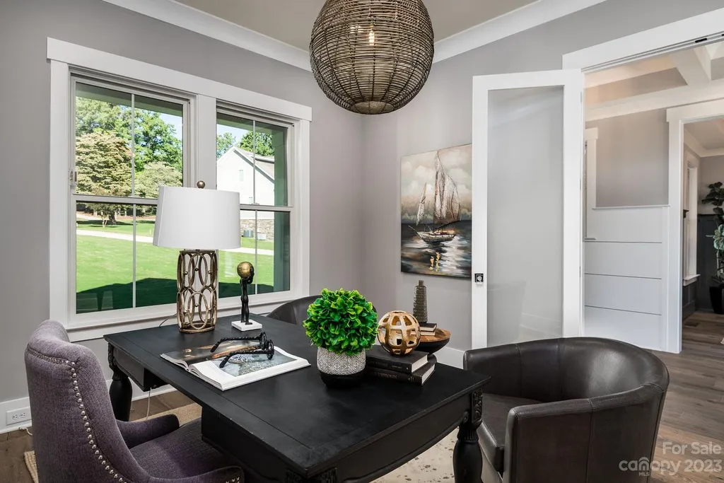 155 Riverwood Road Home in Mooresville, North Carolina. Experience the epitome of luxury in this new construction home on Lake Norman. Boasting 4 bedrooms, 4.5 bathrooms, a pool, dock, and breathtaking lake views, this home offers a lifestyle of comfort and elegance. 