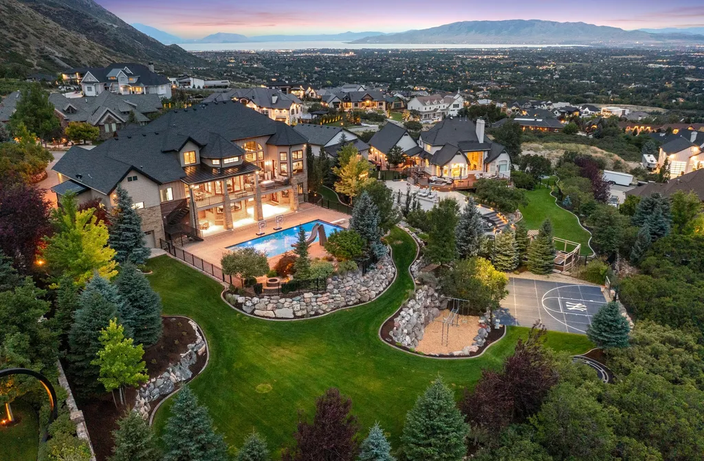 1643 E Box Elder Drive Home in Alpine, Utah. Few homes capture the majesty and beauty of Alpine's surrounding mountains like this one. This former parade of homes prize winner boasts panoramic views from every room. Impeccable attention to detail is evident throughout, with beautiful wood trim accentuating the warmth of the gathering areas. 
