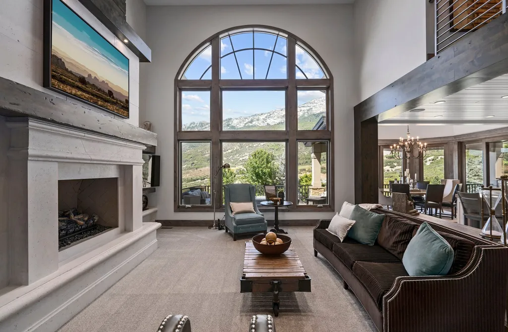 1643 E Box Elder Drive Home in Alpine, Utah. Few homes capture the majesty and beauty of Alpine's surrounding mountains like this one. This former parade of homes prize winner boasts panoramic views from every room. Impeccable attention to detail is evident throughout, with beautiful wood trim accentuating the warmth of the gathering areas. 