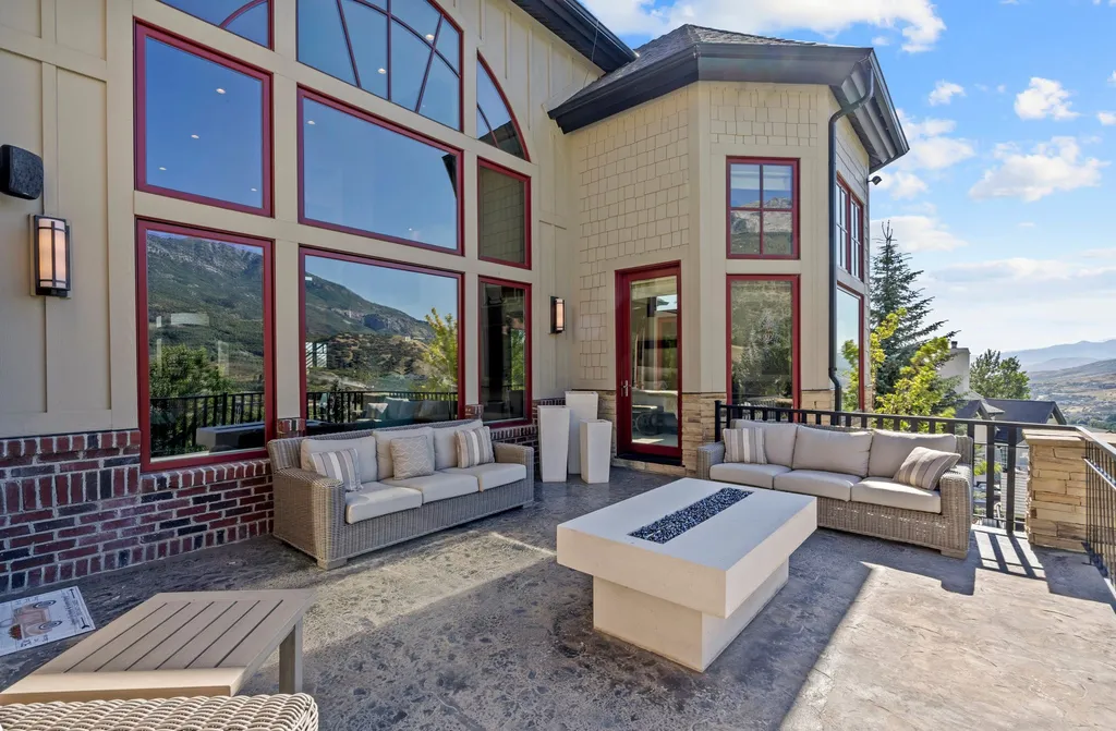 1643 E Box Elder Drive Home in Alpine, Utah. Few homes capture the majesty and beauty of Alpine's surrounding mountains like this one. This former parade of homes prize winner boasts panoramic views from every room. Impeccable attention to detail is evident throughout, with beautiful wood trim accentuating the warmth of the gathering areas. 