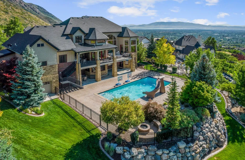1643 E Box Elder Drive Home in Alpine, Utah. Few homes capture the majesty and beauty of Alpine's surrounding mountains like this one. This former parade of homes prize winner boasts panoramic views from every room. Impeccable attention to detail is evident throughout, with beautiful wood trim accentuating the warmth of the gathering areas. 