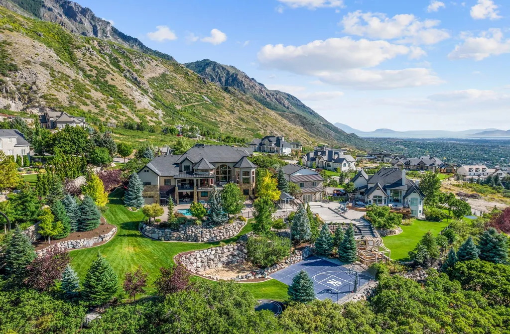 1643 E Box Elder Drive Home in Alpine, Utah. Few homes capture the majesty and beauty of Alpine's surrounding mountains like this one. This former parade of homes prize winner boasts panoramic views from every room. Impeccable attention to detail is evident throughout, with beautiful wood trim accentuating the warmth of the gathering areas. 