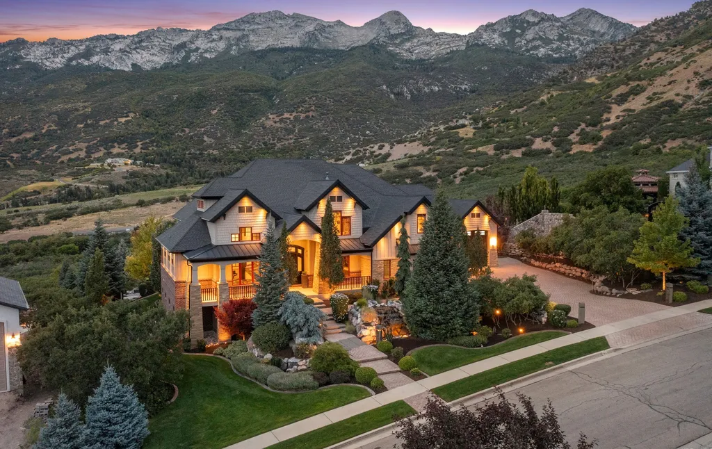 1643 E Box Elder Drive Home in Alpine, Utah. Few homes capture the majesty and beauty of Alpine's surrounding mountains like this one. This former parade of homes prize winner boasts panoramic views from every room. Impeccable attention to detail is evident throughout, with beautiful wood trim accentuating the warmth of the gathering areas. 